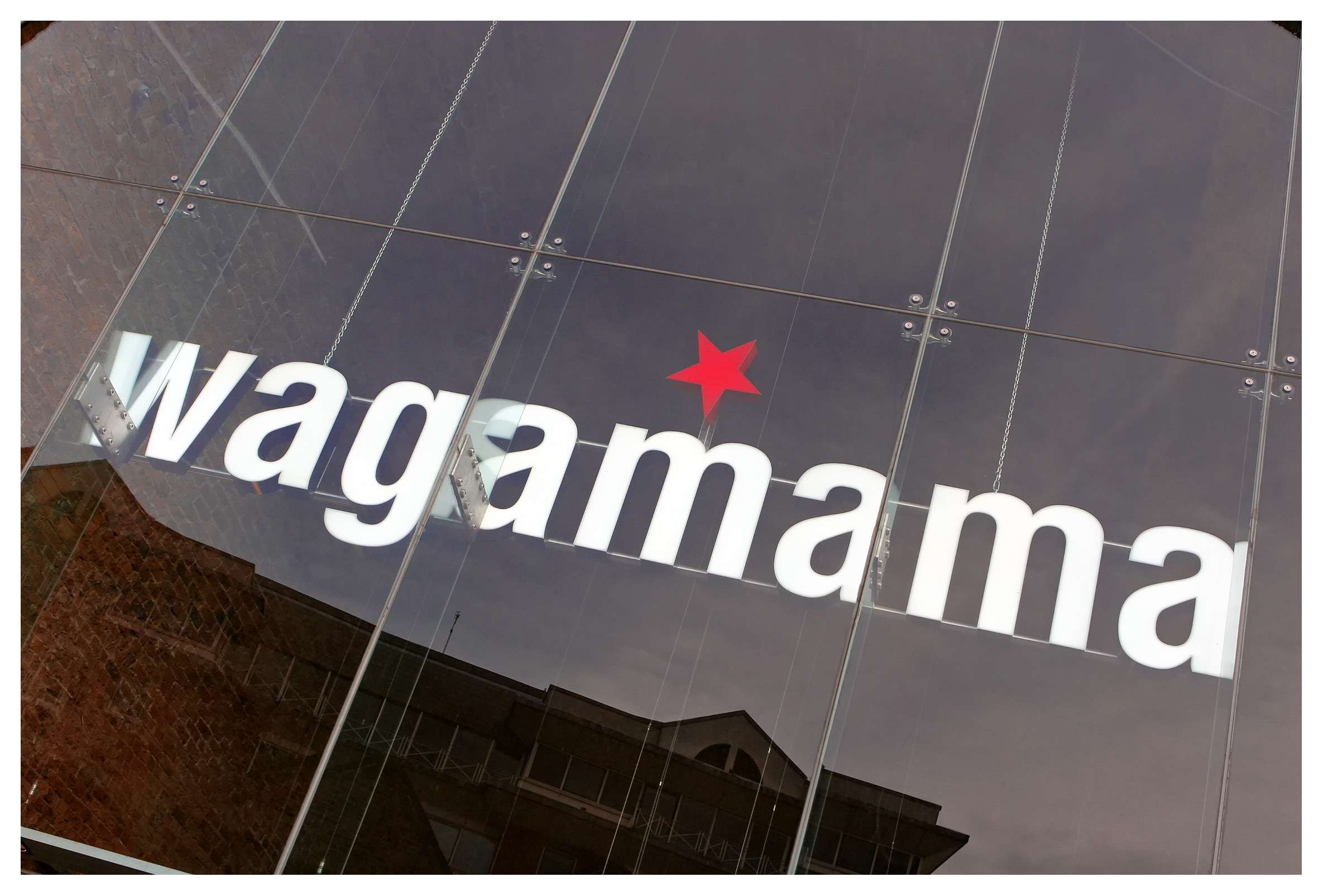 Architectural photography: glass facade of Wagamama restaurant near London Bridge, London, England