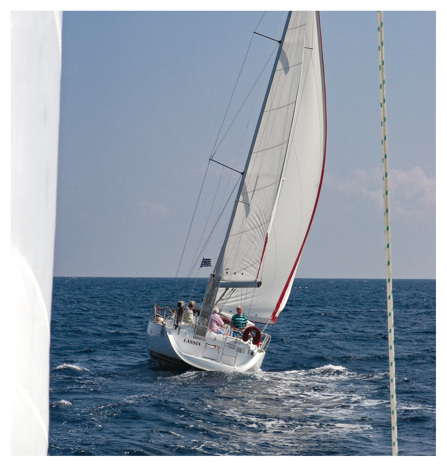 Yachting photography: A sailing yacht under way in a blue sea, Cyclades, Greece