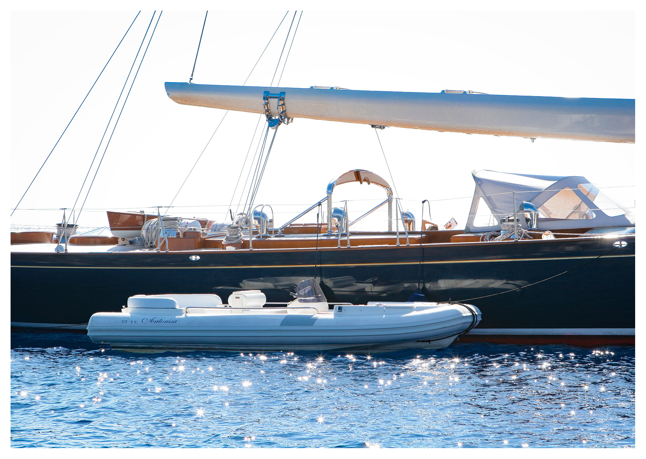 Yachting photography: Sailing yacht Antonisa with her tender anchored off Salina, Aeolian islands, Sicily