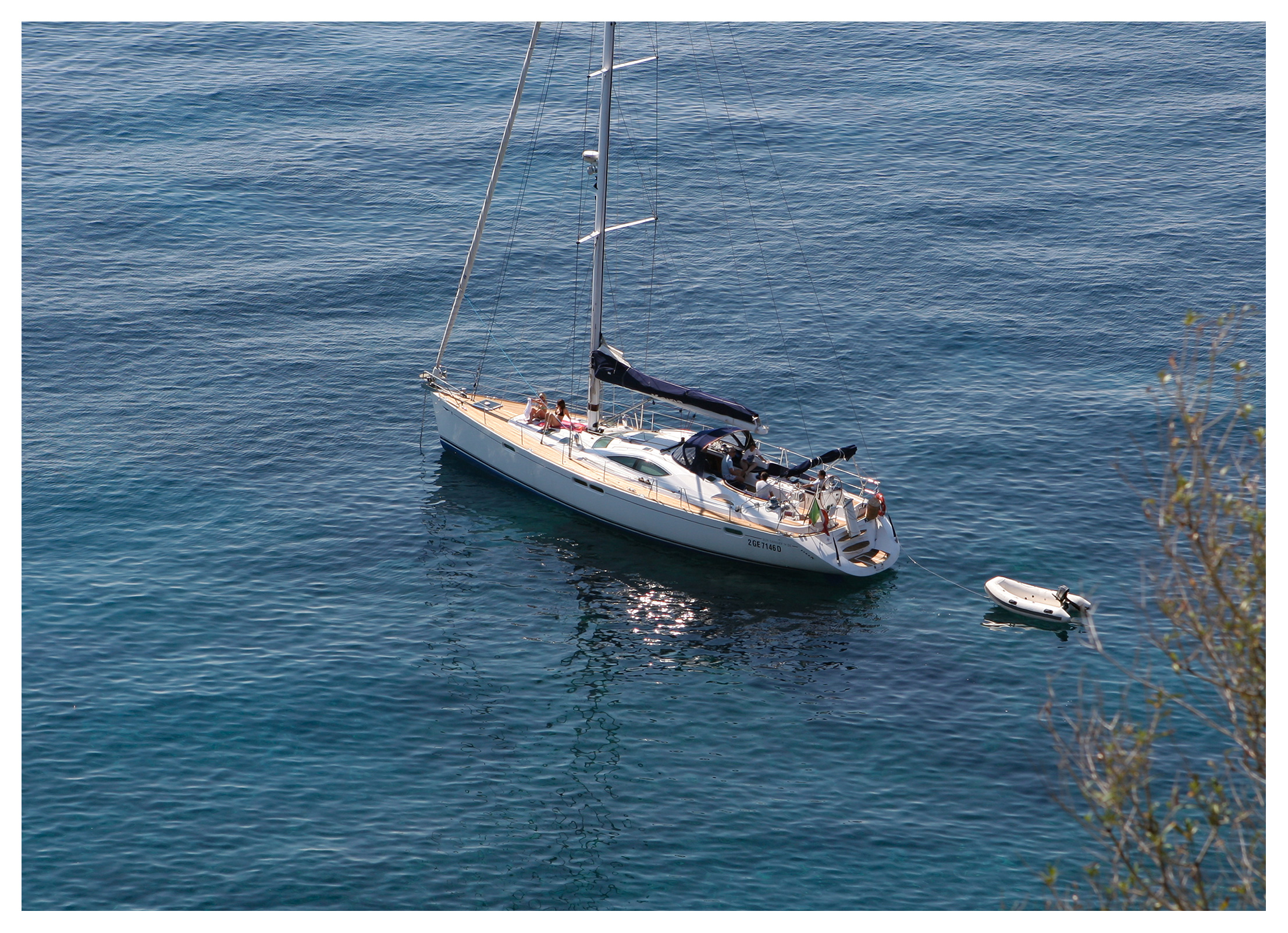 Sailing yacht anchored in clear water off Capo Milazzese, Panarea, Aeolian islands, Sicily